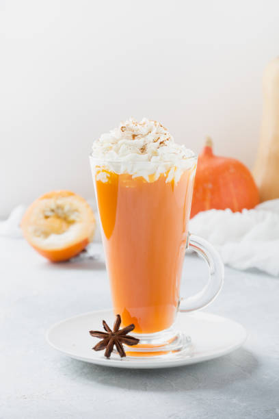 istock Pumpkin drink on light grey. Autumn, fall or winter hot drink. Cozy healthy beverage. 1245963521
