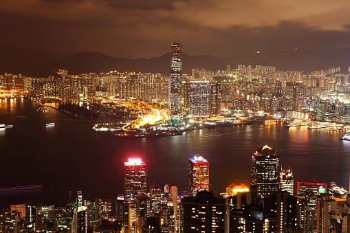 Hong Kong, Hong Kong - 11 29 2017: Hong Kong city skyline Victoria Harbor sunset dusk. Modern architecture skyscrapers business financial district.