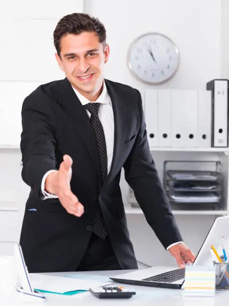 Photo of Businessman offering handshake