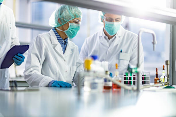 istock Medical experts working on corona virus research in laboratory. 1245979397