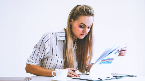istock Blonde business woman working at modern office. 1245986387