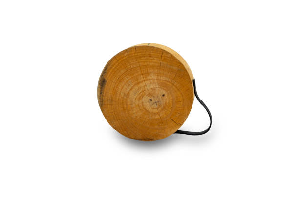 istock Used cutting board.Vintage kitchenware. Genuine old wood cutting board, breadboard, isolated on white. Round (more or less) with handle. 1245987000