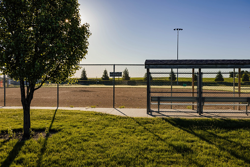 a baseball diamond in a park where games should be played but now only has practices