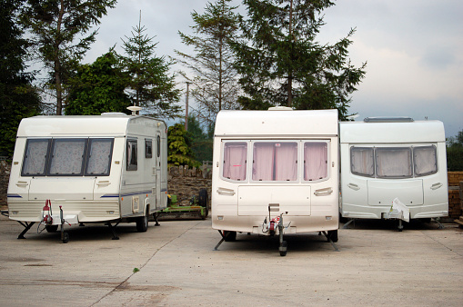 three static caravans in a caravan trailer park.