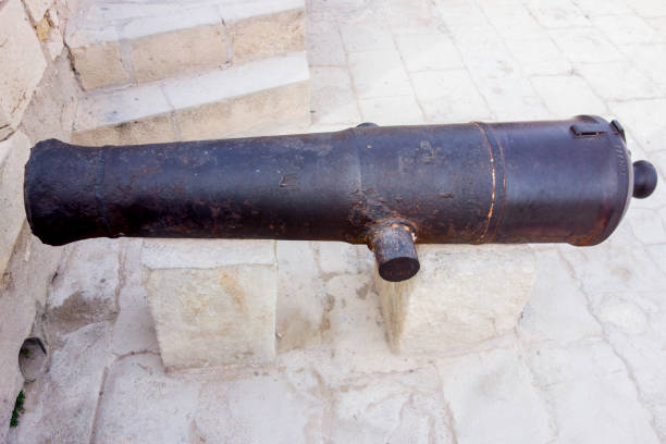 steel cannon in the castle of alicante Alicante, Spain, May,7,2016: steel cannon in the castle of alicante diu island stock pictures, royalty-free photos & images