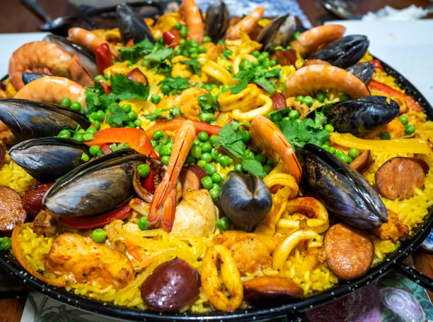 Paella cooked and served in a pan stock photo