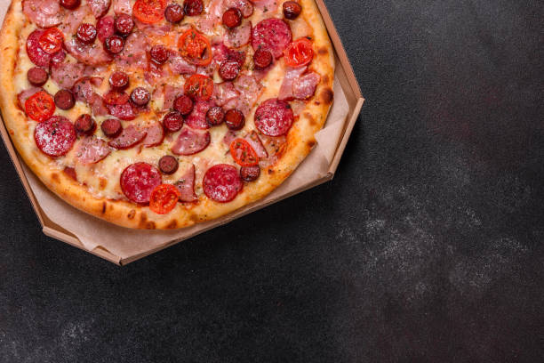 istock Pepperoni Pizza with Mozzarella cheese, salami, ham 1246016244