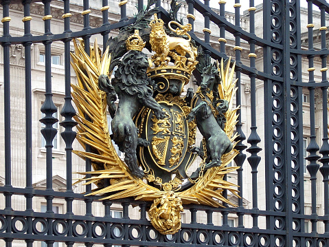 Royal Coat of Arm (royal seal) on Buckingham Palace's main gate in London, UK