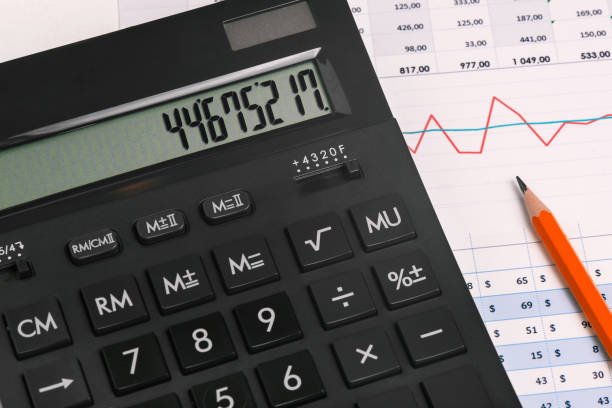 istock Close-up calculator and red pencil on financial documents. Graph with numbers and statistics. Market research, statistics and revenue analysis. 1246019031