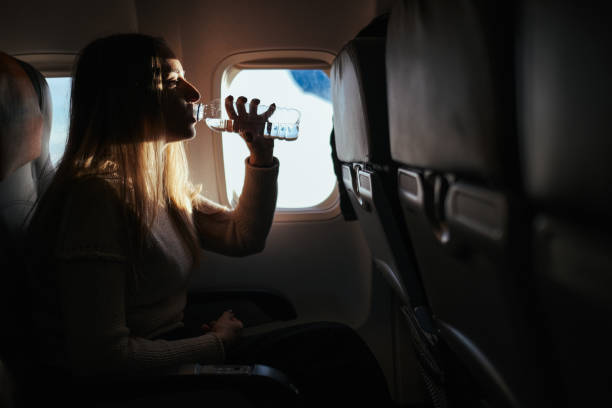 istock Young woman travelling with airplane 1246023892