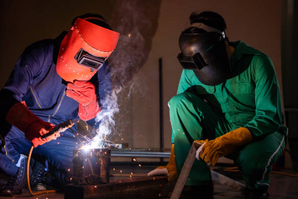 istock Metal welding steel works using electric arc welding machine 1246028979