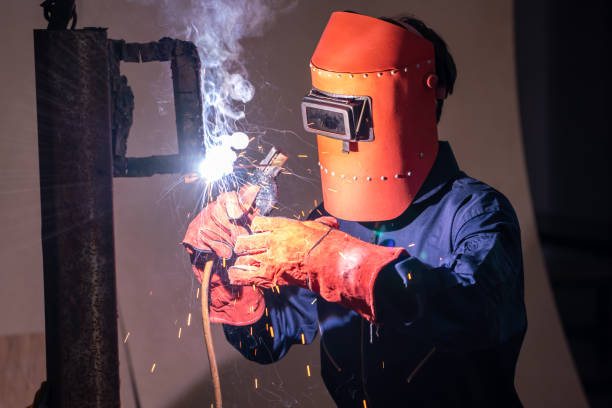 istock Metal welding steel works using electric arc welding machine 1246029058