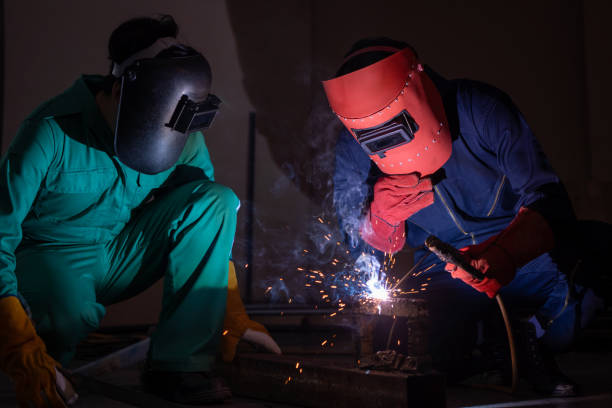 istock Metal welding steel works using electric arc welding machine 1246029089