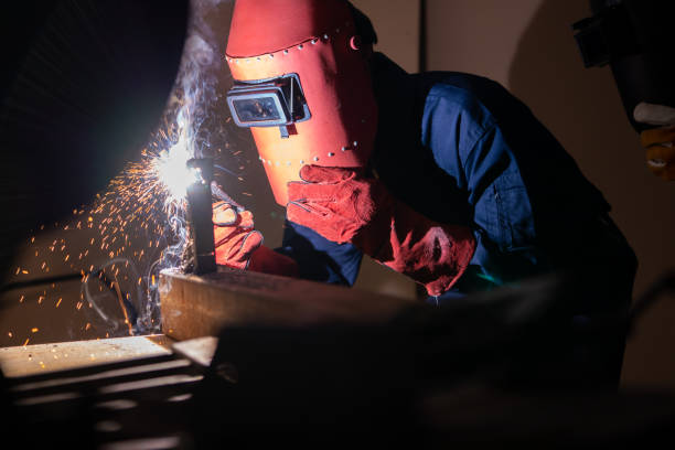 istock Metal welding steel works using electric arc welding machine 1246029102