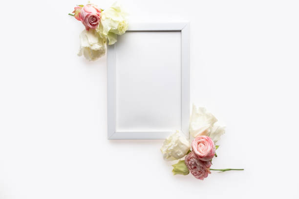 istock Beautiful flowers composition. Blank frame for text, white flowers on white background. Valentines Day, Easter, Birthday, Happy Women's Day, Mother's day. Flat lay, top view, copy space 1246029199