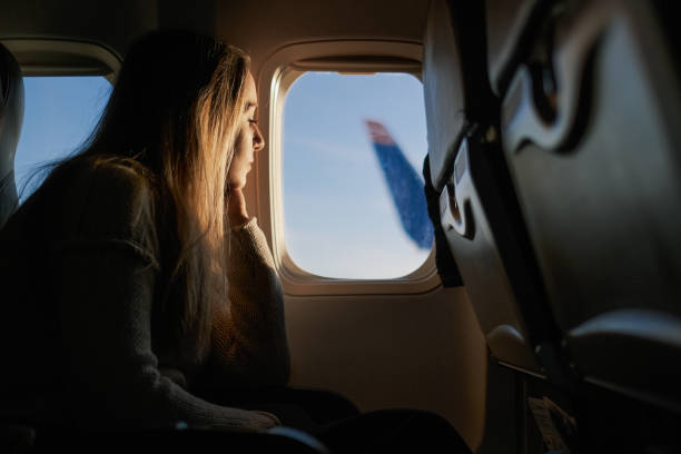 istock Young woman travelling with airplane 1246029501