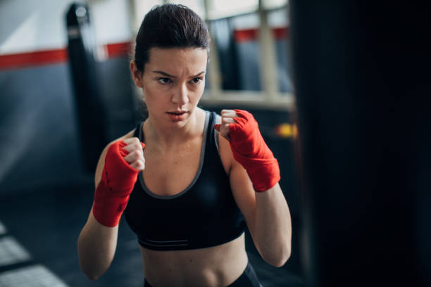 istock Female boxer standing in fighting stance 1246029560