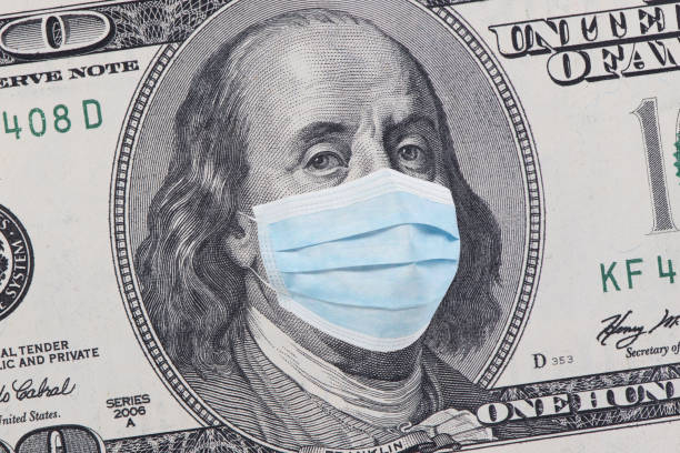One hundred dollars banknote One hundred dollars banknote with facemask. American cash money. Financial crisis and coronavirus pandemic concept. COVID-19 coronavirus in USA. benjamin franklin photos stock pictures, royalty-free photos & images