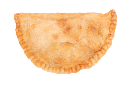 pies empanadas on a plate with lettuce and sauce closeup. horizontal