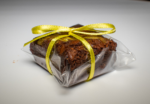 Brownie piece packed in transparent package with yellow ribbon bow, Rio de Janeiro, Brazil