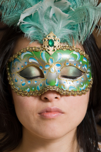 Model Khana with costume mask and eyes closed to show eye make up.