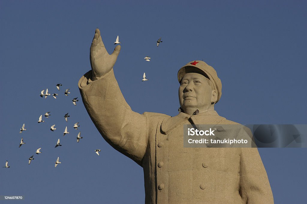 Mao Zedong Statue pigeons flying closeby Mao Zedong statue in Renmin Square. Kashgar (Kashi). Xinjiang Uyghur Autonomous Region. China. Dictator Stock Photo