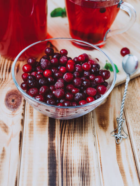 istock frosted wild cranberries in a glass cup - ingredient for making berry juice 1246114478