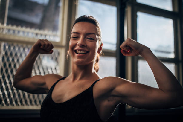 istock Beautiful strong woman in gym 1246138817