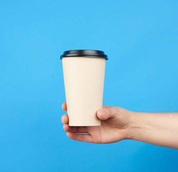 istock brown paper disposable cup with a plastic lid 1246145318