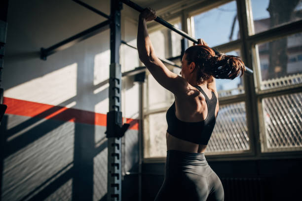 istock Fit young woman training alone in gym 1246146584