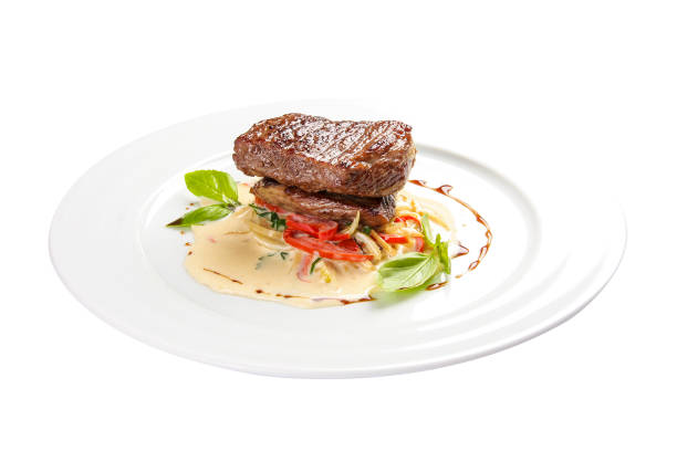 istock Veal medallion with vegetables. On a white background 1246160005