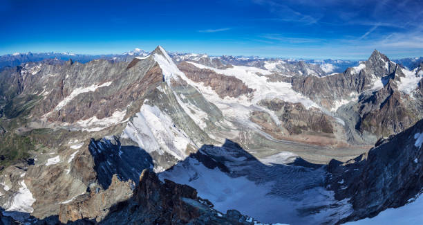istock Alpine beautiful landscape. Panoramic view on Alps peaks and glacier. Lion ridge. 1246161167