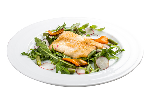 Fried bass with salad. On a white background