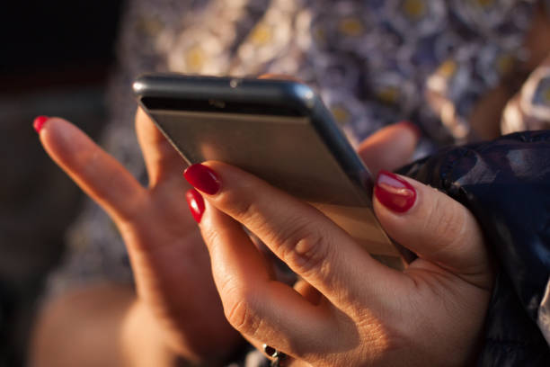 istock Mobile phone in women hands 1246168470