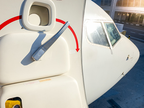 Closeup photo of door handle on the passenger airplane