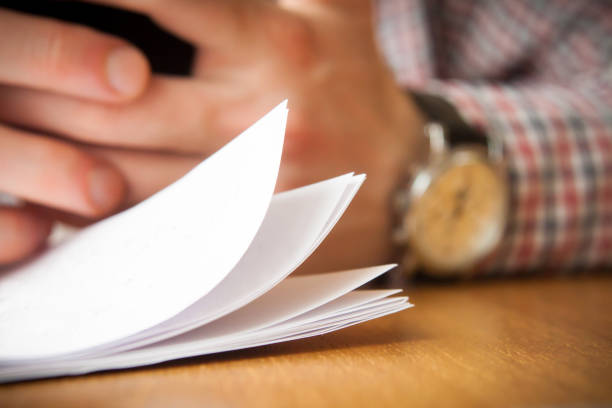 istock White papers in front of male 1246171856