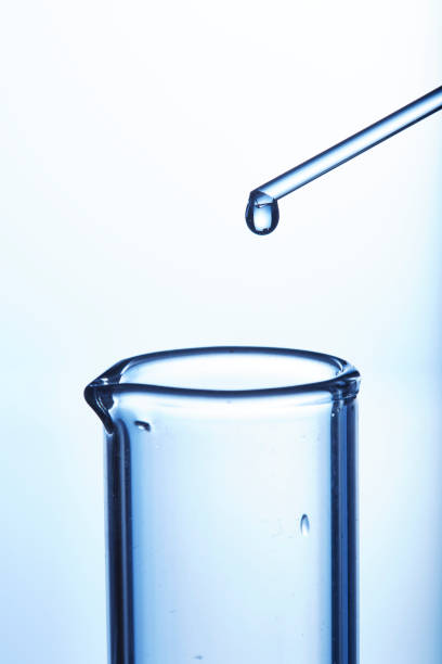 istock Single drop of liquid leaving pipette 1246177861