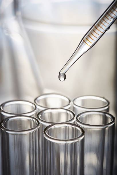 istock Single drop of liquid leaving pipette 1246180846
