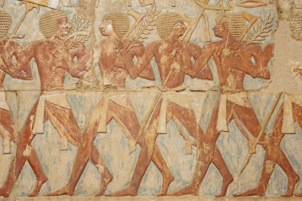 istock Hieroglyphic carvings on an ancient egyptian temple wall 1246191825