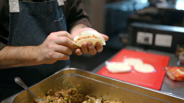 Cook preparing Empanadas