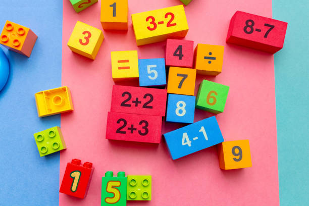 istock child kid colorful education toys cubes with numbers math pattern background on the bright background. Flat lay. Childhood infancy children babies concept. 1246196334