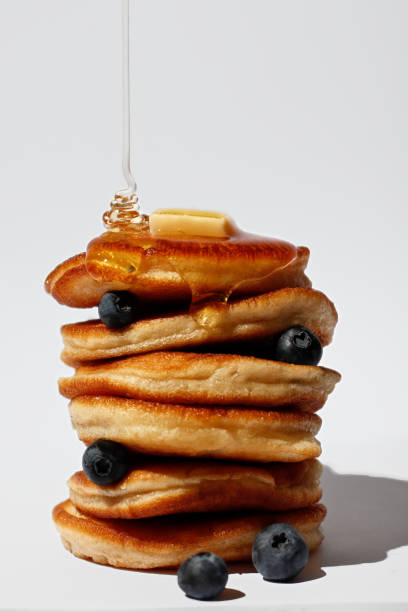 Pancakes with maple syrup isolated on a white background. Breakfast, snacks.