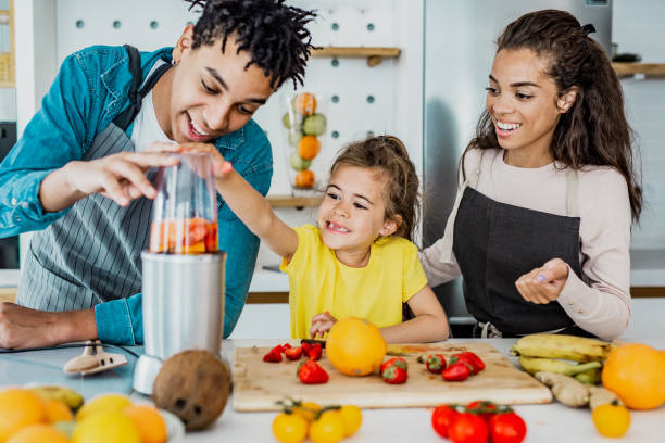 istock Young family prepare a healthy drink in kitchen 1246203939