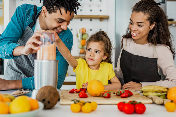 istock Young family prepare a healthy drink in kitchen 1246206148