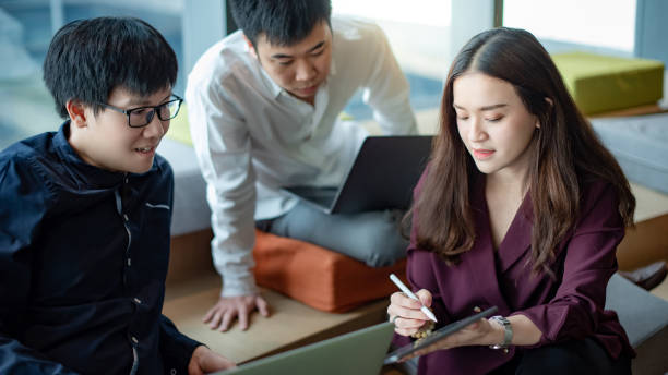 istock Asian colleagues sharing ideas in office meeting room 1246206188