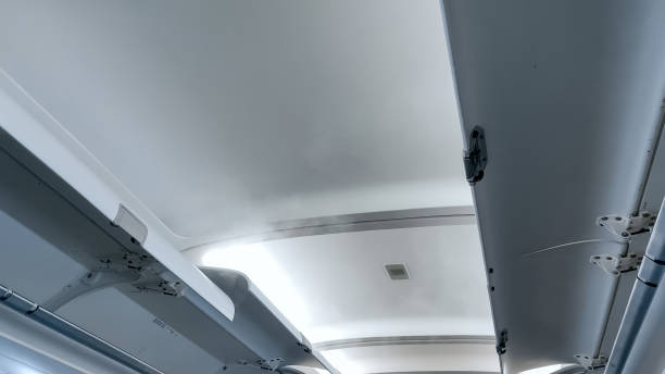 istock Open luggage storage area under the ceiling at airplane 1246208479