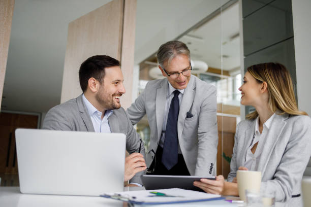 istock Senior manager getting updated by his staff 1246216043