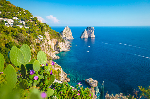 Famous Faraglioni rocks on the coast of Capri island in Italy.