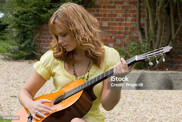Playing Her Guitar Stock Photo - Download Image Now - Acoustic Guitar, Adult, Adults Only