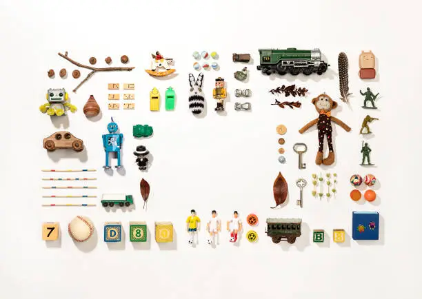 Photo of Set of colorful vintage toys on white background